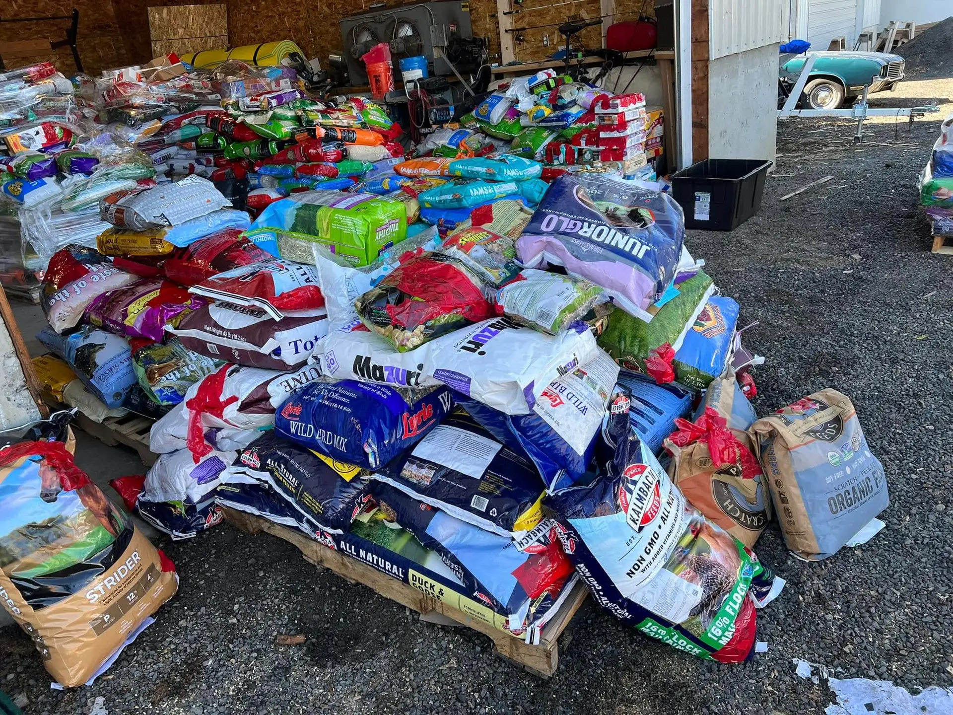 Stacks of donated pet food ready to help local families